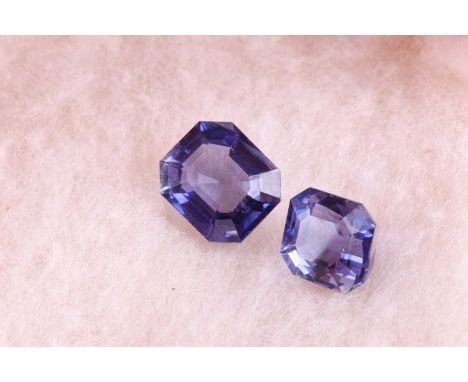 Two loose iolite gemstones of approximatey 5.0 carats combined, together with a yellow gemstone (possibly sapphire), a small 