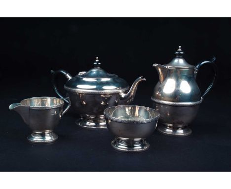 A George V silver four-piece tea set, Birmingham 1931 by Dennison, comprising a teapot, hot water pot, sucrier and creamer, t