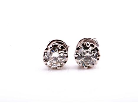 A pair of solitaire diamond ear studs, set with round brilliant-cut diamonds of approximately 1.50 carats combined, approxima