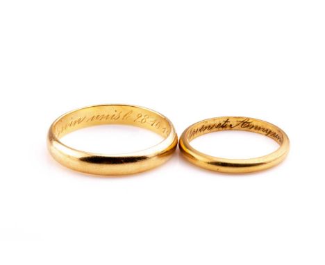 A yellow metal gents wedding band ring, with personal inscription to shank, indistinct mark, size S, together with a smaller 