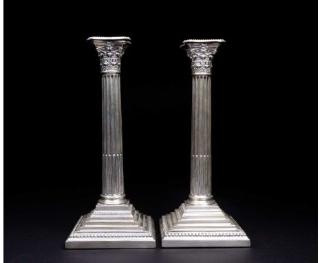 A matched pair of late Victorian silver candlesticks, John Aldwinckle & Thomas Slater, London 1889/90, with beaded removable 