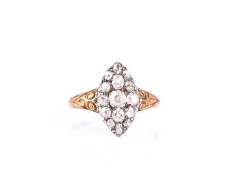 A late 19th century diamond ring, the navette-shaped mount inset with old-cut diamonds, largest central diamond approximately