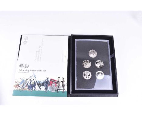 Three sets of The Royal Mint 50 Years of the 50p British Military Set, boxed with certificates; together with a two silver cr