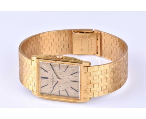 An Audemars Piguet ref. 5228BA 18ct yellow gold dress watch c.1969, the rectangular textured gilt dial with slim black baton 