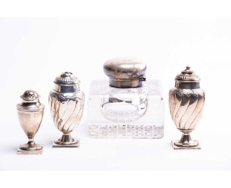 A pair of silver pepperettes, together with another smaller, various dates and makers and asilver mounted glass inkwell of sq