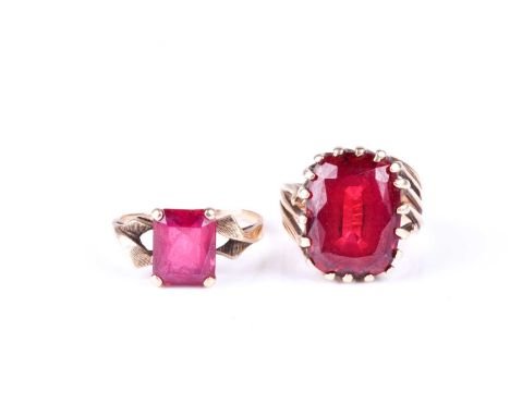 A 14ct yellow gold and red paste stone cocktail ring, size K 1/2, together with a yellow metal and red paste stone ring set w