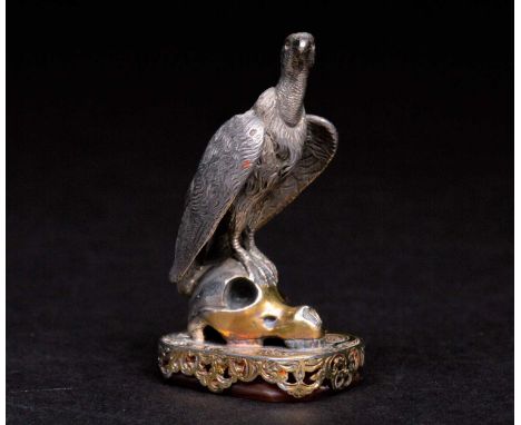 An unusual 19th century vulture mounted momento-mori desk seal, with carnelian intaglio to the base, white and gilt metal, th