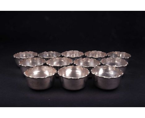 A set of twelve Continental silver finger bowls, each with frilled edge, marked 'Silver' to base, 5.7 cm high x 11 cm diamete