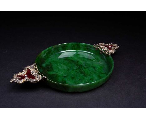 A Russian nephrite jade shallow bowl, 20th century, the rococo style handles in silver gilt and red enamel set with diamonds,