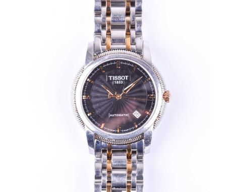 A Tissot automatic stainless steel wristwatch, the black engine-turned dial with gilt baton indices, date aperture, on a two-