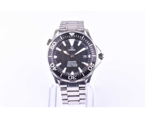 An Omega Seamaster stainless steel automatic wristwatch the black engine-turned dial with luminous hour markers and date aper