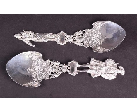 A pair of German Hanau silver figural spoons, 1899 by Berthold Muller, the finials depicting Henry VIII and Elizabeth I, each