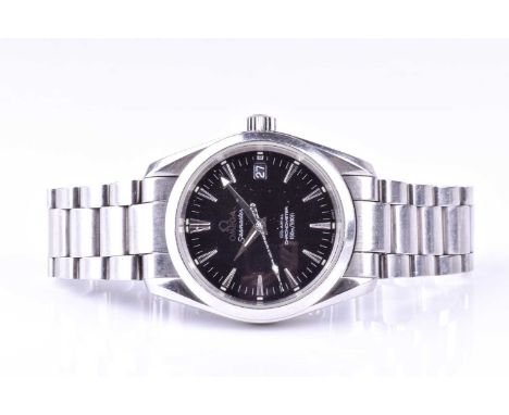 An Omega Seamaster Co-axial chronometer stainless steel automatic wristwatch, the black dial with baton indices and date aper