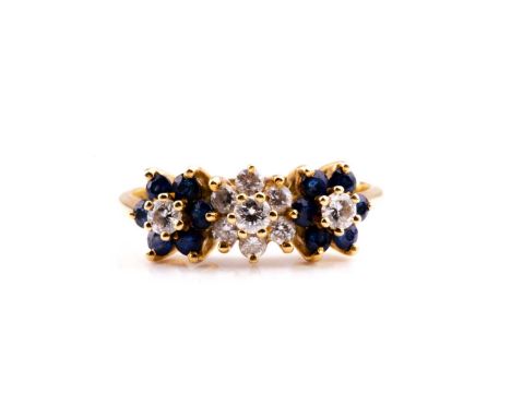 An 18ct yellow gold, diamond and sapphire triple floral cluster ring, the diamonds of approximately 0.15 carats combined, siz