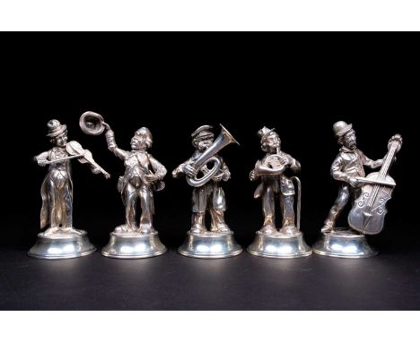 A group of five Spanish silver street musicians, circa 1960s, playing a variety of instruments, on raised circular bases, 100