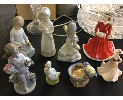 A selection of various figurines including two Lladro, one Royal Osborne, Coalport 'Meryl' and 'Sophie', one Beswick duck and