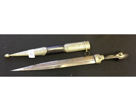 A Middle Eastern dagger and scabbard with white metal engraved section with cow horn handle.