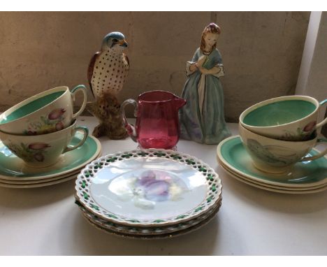 A Royal Worcester figurine 'Sweet Anne', four Susie Cooper cups and six saucers, Berwick falcon, cranberry glass jug and thre