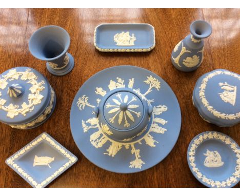 A collection of Wedgwood items including three trays, three lidded pots, two vases, one plate with another ceramic plate.
