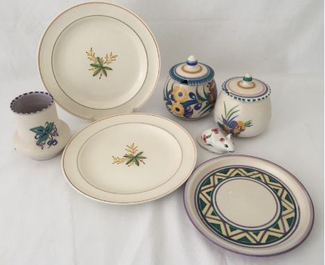 7 items of Poole pottery. To include a plates, bud vase and a lidded jam pot. 