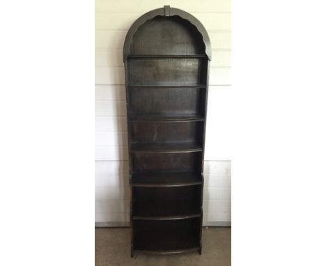 A 7 shelf bookcase with arch top.  71cm tall x 54cm wide.