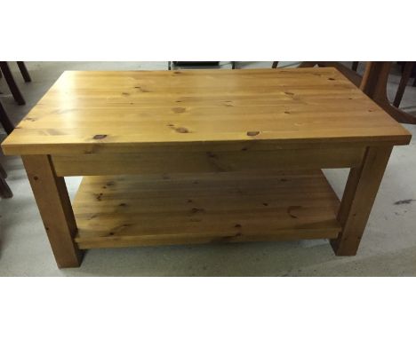 A modern pine rectangular coffee table with lower shelf.  Approx. 106.5 x 61cm.