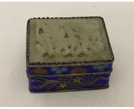 A small rectangular Cloisonné pill box with a carved Jade panel set into lid.  