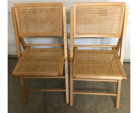 2 modern light beech wood folding dining chairs. With cane seats and backs. 