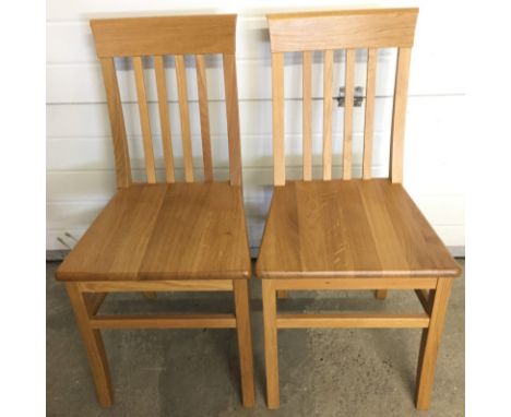 2 modern light oak dining chairs  