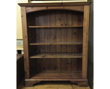 A stained pine 4 shelf bookcase with shaped front. 3 moveable shelfs. Approx. 96 x 120cm tall.