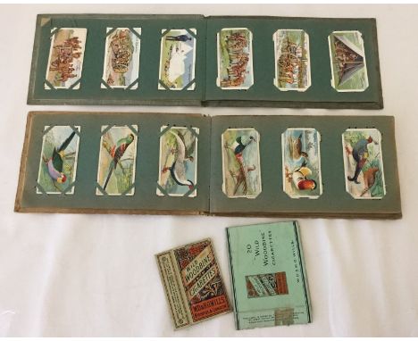 Two vintage cigarette card albums. To include a full set of Players Army Life issued 1910 in a set of 25 and other loose card