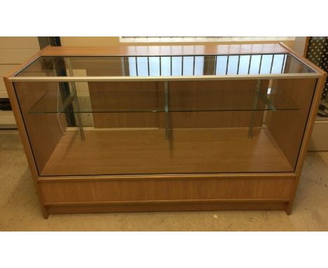A large modern pine effect & glass shop counter. With internal lighting. Measures approx 150cm x 61cm x 91cm.