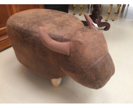 A novelty pouffe in the form of a bull