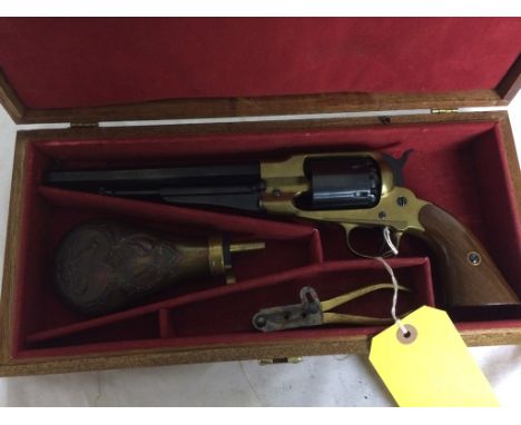 A fine boxed blank firing Remington; together with a powder flask and mould