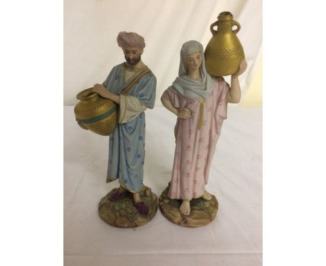 A pair of 19th century Royal Worcester water carriers with green mark to base A/F CONDITION REPORT: The head of the male figu