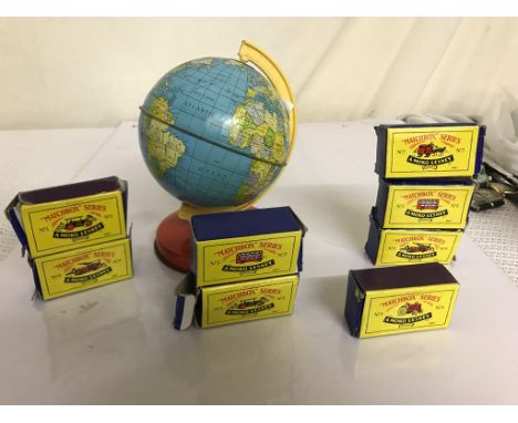 A miniature globe; together with boxed Matchbox cars