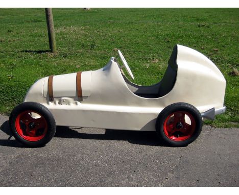 A factory-built childs' pedal-car of the famous pre-war "Twin-cam" 750 racer c1947; restored usable condition refinished in o