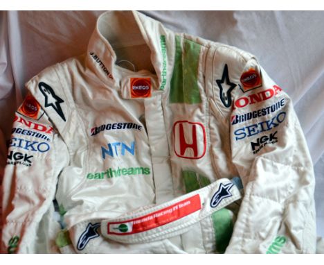 An original race-worn suit as used during the 2007 season. Button was driving the Honda RA107, with his best result a 5th pla