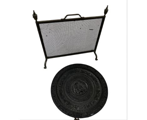 Large fiberglass relief moulded charger, together with a brass firescreen (2)
