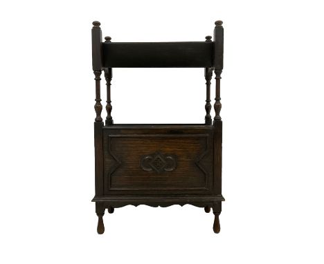 20th century oak magazine rack, the trough top raised on turned supports, main two division with moulded and carved panels