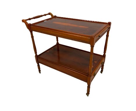 Regency design yew wood two tier drinks trolley, fitted with drinks slide, raised on ring turned supports on castorsDimension