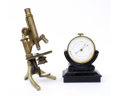 Holosteric barometer within a brass case upon a carved ebonised wooden stand, 8" high; together with an antique monocular bra