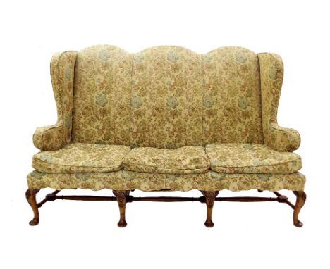 George I style high back upholstered sofa, with camel back and floral upholstery, three cushions and four cabriole front legs