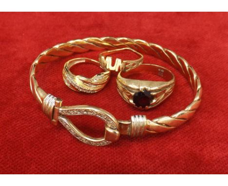 (201600188) 9ct stone set bangle, 22.7gm; together with three 9ct rings, 8.6gm (4)