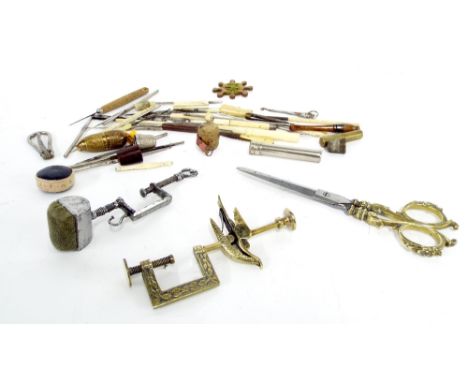 Antique sewing tools and accessories to include a polished brass sewing clamp in the form of a bird, polished steel sewing cl