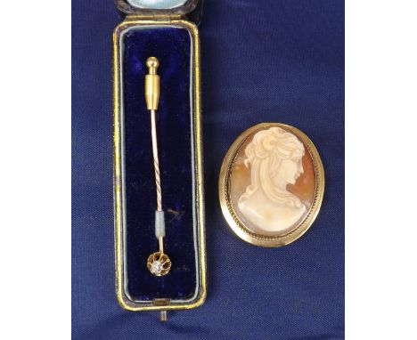 9ct mounted oval shell cameo brooch depicting a profile of a lady, 42mm x 35mm; together with an old-cut diamond mounted stic