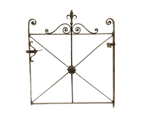 Mid 19th century cast and wrought iron hand gate, centrally decorated with a flowerhead, with swan neck pediment surmounted b