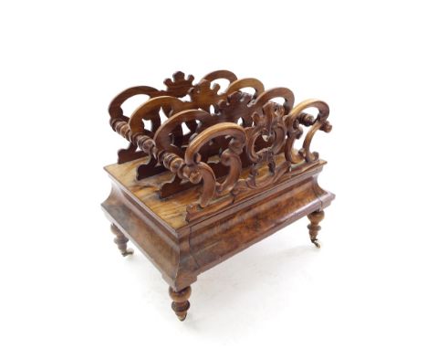 Victorian burr walnut Canterbury, with scrolled cartouche sections and cushioned hidden drawer upon four turned feet and cera