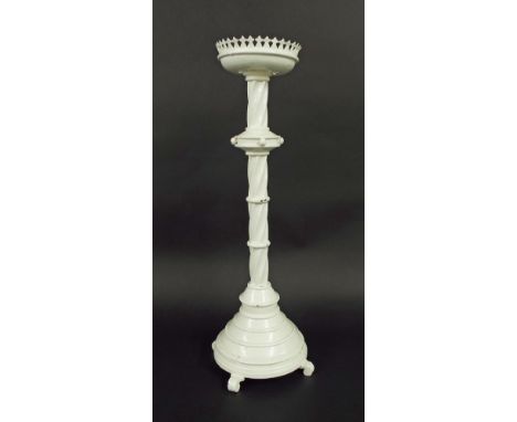 Large painted brass ecclesiastical candlestick, the white sconce with turreted edges upon a barley twist column and stepped c
