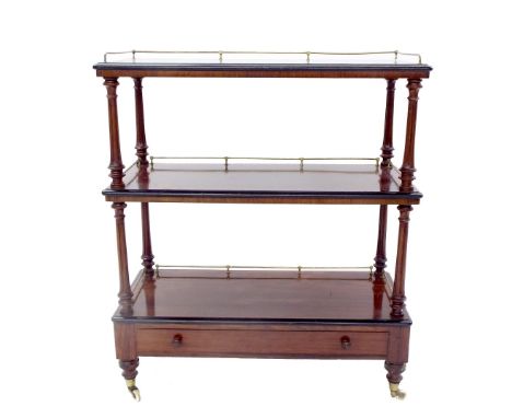 Good Victorian rosewood three tier buffet, with raised brass gallery rail, reeded baluster supports and a base fitted with a 